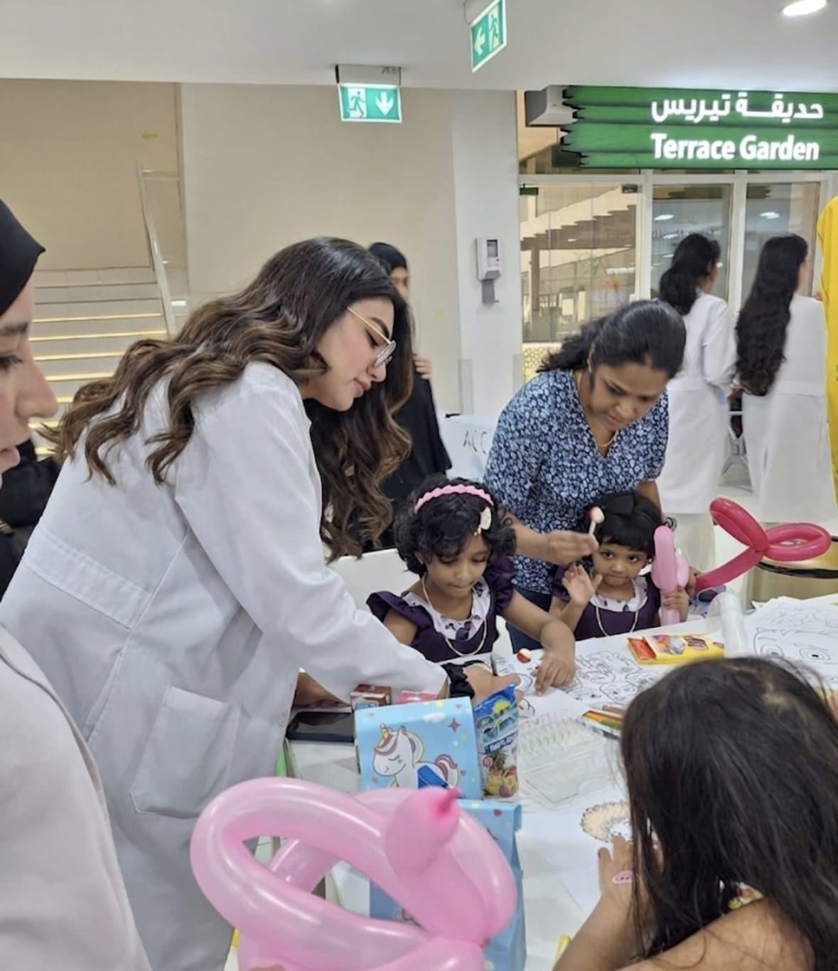 Colouring and craft table prepared for pediatric patients and their families