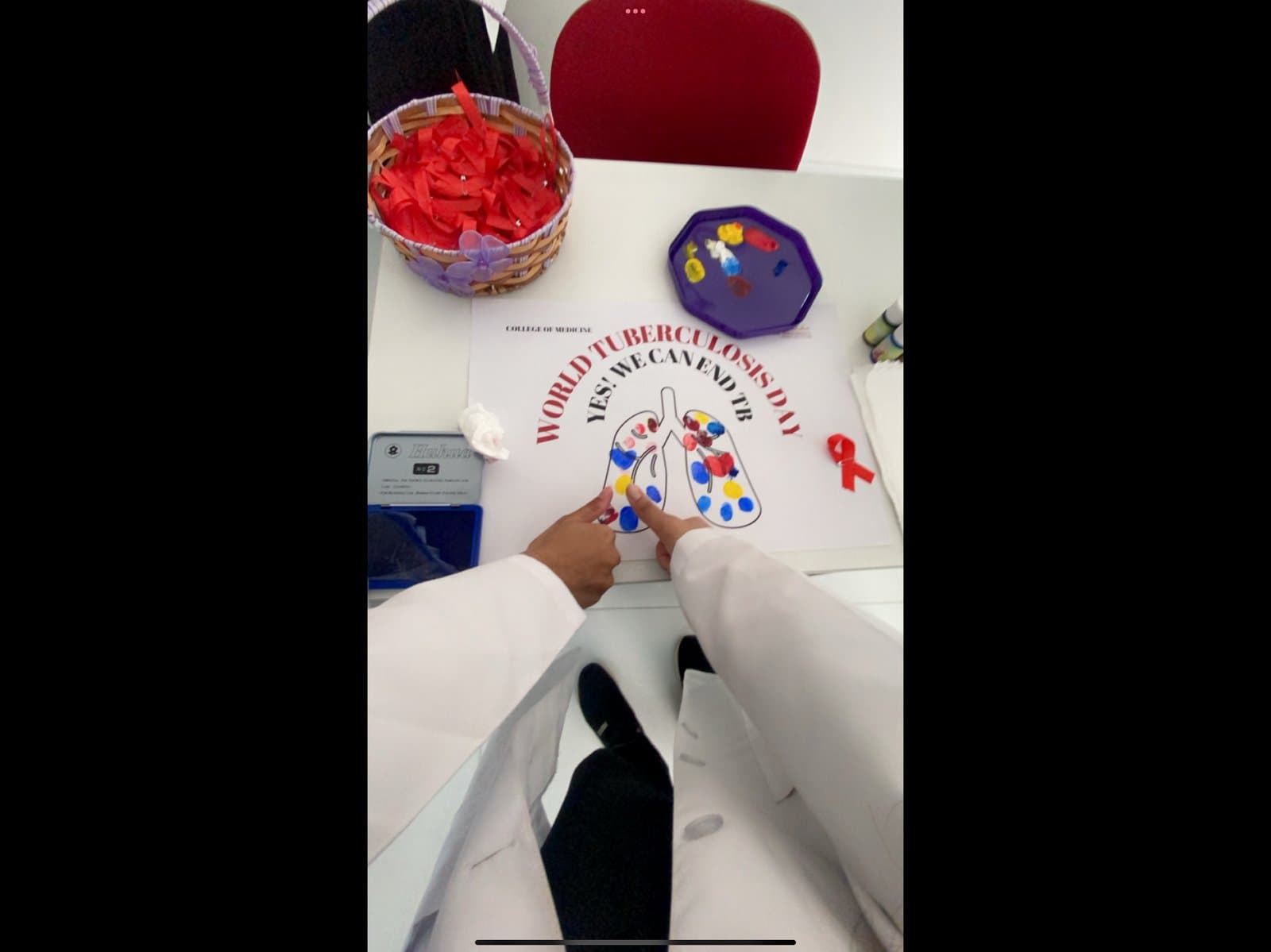 Fingerprint-art lung poster activity for World Tuberculosis Day at Gulf Medical University